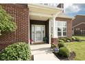 Welcoming front entrance with well-manicured landscaping and an inviting porch at 750 Trillium St, Lebanon, IN 46052