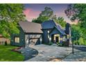 Beautiful, single-Gathering home with black brick and complementary roof with a three-car garage and basketball court at 826 N Lanyard Dr, Cicero, IN 46034