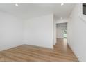 Bright and open living room with modern recessed lighting and wood look floors at 848 Holmdale Dr, Indianapolis, IN 46239