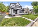 Charming two-story home with landscaped yard and inviting curb appeal, perfect for families at 911 Eastern Ave, Indianapolis, IN 46201