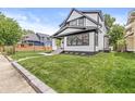 Well-maintained front yard and charming two-story home in a desirable neighborhood, close to amenities at 911 Eastern Ave, Indianapolis, IN 46201