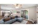 Open floor plan featuring living room, kitchen, and sliding door to deck at 9378 N County Road 75 W, Lizton, IN 46149