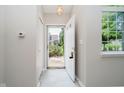 Bright entryway with neutral tones and open door showing exterior view at 9406 Avon Strand # Apt A, Avon, IN 46123