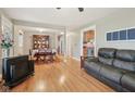 Open-concept living and dining areas with hardwood floors and great natural light at 9974 N 850 W, Fairland, IN 46126