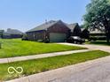 Well-kept brick home with attached garage, green lawn, and inviting curb appeal at 1027 Plum St # 39, Brownsburg, IN 46112