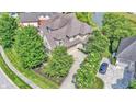 Sprawling home with mature trees, a long driveway, and lush landscaping at 10471 Winghaven Dr, Noblesville, IN 46060