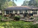 Backyard deck with well-maintained flowers and plenty of space for outdoor entertainment at 108 Meadowview Dr, Mooresville, IN 46158
