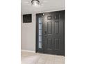 Stylish front door with decorative panels and glass insert, inside the home at 11218 Baycreek Dr, Indianapolis, IN 46236