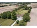 Aerial view capturing a lovely home embraced by lush greenery and expansive farmland, creating a serene and private setting at 13666 E 166Th St, Noblesville, IN 46060
