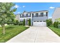 Inviting two-story home with a vibrant yellow door, attached two-car garage, and landscaped front yard at 13844 N Cardonia Dr, Camby, IN 46113