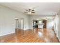 Open floor plan living room leading to a kitchen with stainless appliances at 18005 Gasparilla Ct, Westfield, IN 46062