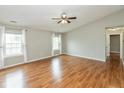 Spacious living room featuring hardwood floors, neutral paint, and natural light at 18005 Gasparilla Ct, Westfield, IN 46062