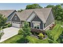 A view of the property showcasing lush greenery and a well-maintained lawn at 18998 Beverly Shones Ln, Noblesville, IN 46062