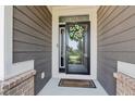 A close up shot of the front door with wreath and welcome mat at 18998 Beverly Shones Ln, Noblesville, IN 46062