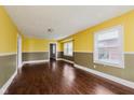 Spacious living room with hardwood flooring and natural light from multiple windows at 1938 N Dearborn St, Indianapolis, IN 46218