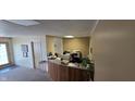 A reception desk with wood trim and plants nearby at 22 W 8Th St, Anderson, IN 46016