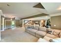 Spacious living room with stairs, double doors, dining area, and comfortable seating at 2213 E Canterbury Ct, Martinsville, IN 46151