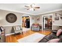 Inviting living room boasts hardwood floors, neutral paint, and plenty of natural light at 2907 Jay Dee Ln, Greenwood, IN 46143