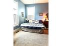 Cozy bedroom with carpet, featuring natural light from the windows and comfortable decor at 317 W State Road 44, Franklin, IN 46131