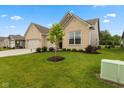 Attractive home with a well-kept lawn, a three-car garage, and inviting curb appeal at 3599 Chalmers Dr, Bargersville, IN 46106