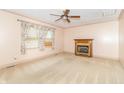 Cozy bedroom with a decorative fireplace, plush carpet, and soft lighting, creating a relaxing and inviting atmosphere at 391 W 500 S, Anderson, IN 46013
