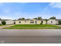 Classic single-story home with a well-manicured lawn, offering a cozy curb appeal at 4697 W Ridge Dr, Columbus, IN 47203