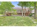 Expansive deck offering views of the lush backyard and mature trees at 545 Pitney Dr, Noblesville, IN 46062