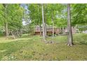 Serene backyard featuring a spacious deck and lush greenery, perfect for outdoor relaxation at 545 Pitney Dr, Noblesville, IN 46062