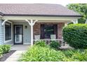 Cozy front porch with comfortable rocking chairs, perfect for relaxing and enjoying the outdoors at 7686 Micawber Ct, Indianapolis, IN 46256