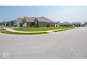 A brick house with a well-manicured lawn situated in a suburban neighborhood at 9001 Fitzgerald Dr, Indianapolis, IN 46239