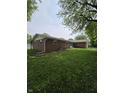 Brick home featuring well-maintained landscaping and a cozy, inviting feel at 9984 W Sunset Ln, Elwood, IN 46036