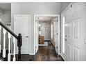 Hallway that showcases an office with natural light and a modern chandelier at 10717 Windermere Blvd, Fishers, IN 46037
