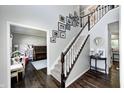 Staircase leading to the upper level, adorned with Gathering photos and stylish décor at 10717 Windermere Blvd, Fishers, IN 46037