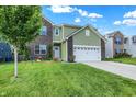 Two-story home with a brick and siding exterior and well-maintained lawn at 10902 Jimmy Lake Dr, Indianapolis, IN 46239