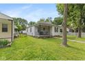 A cozy home exterior with a small porch and well-manicured lawn in a friendly neighborhood at 1116 N Berwick Ave, Indianapolis, IN 46222