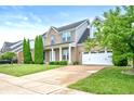 Lovely two-story home featuring a well-maintained lawn and attached two-car garage at 1143 Hampton Dr, Greenwood, IN 46143
