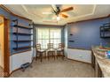 Inviting dining area with ample lighting, shelving, and space for entertaining at 1159 Oak Leaf Rd, Franklin, IN 46131