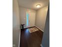 Bright foyer with hardwood flooring and decorative rug near the front door at 12328 Quarry Face Ct, Fishers, IN 46037
