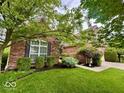 Well-maintained brick home showing landscaped bushes, trimmed hedges and an attractive lawn at 12656 Cerromar Ct, Carmel, IN 46033
