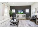 Stylish living area with sleek furniture, neutral colors, and a TV at 138 Rock Island Rd, Westfield, IN 46069