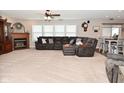 Spacious living room with plush carpet, fireplace, and comfortable sectional sofa at 1744 Salina Dr, Avon, IN 46123