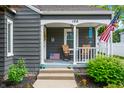 Inviting front porch with seating and charming decor, offering a cozy outdoor space at 188 Maple Ln, Franklin, IN 46131