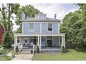 Charming two-story home boasts a classic facade with a covered front porch for outdoor seating at 250 N Home Ave, Franklin, IN 46131