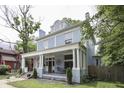Angle of a two-story home featuring a spacious covered front porch for outdoor seating at 250 N Home Ave, Franklin, IN 46131