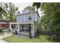 Angle of a two-story home featuring a spacious covered front porch for outdoor seating at 250 N Home Ave, Franklin, IN 46131