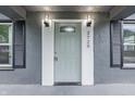 Close-up of the front door with decorative glass and modern lighting at 2720 S Taft Ave, Indianapolis, IN 46241