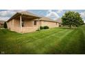 Large, well-maintained backyard with expansive grassy area and mature trees at 3717 Bellmore Dr, Brownsburg, IN 46112