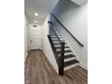 Hallway with luxury vinyl flooring and craftsman trim at 473 Mariposa Trl, Carmel, IN 46032