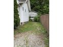 Driveway and yard leading to a detached garage in the backyard at 4931 Orion Ave, Indianapolis, IN 46201