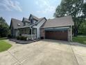 Well-maintained home with an attached garage and a concrete driveway at 530 Denny Dr, Mooresville, IN 46158